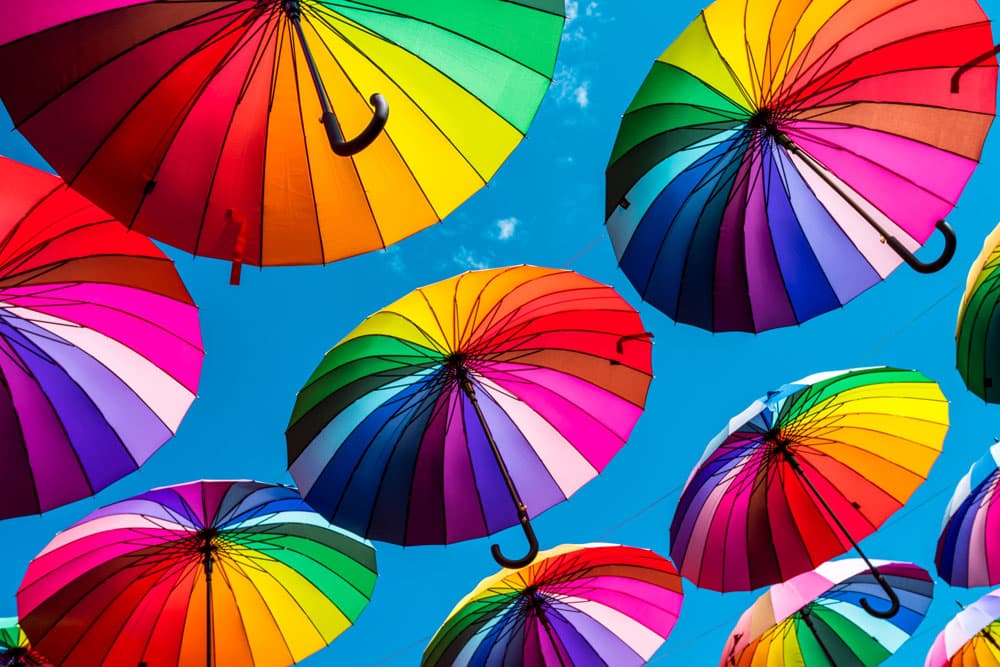 Colorful umbrellas symbolizing diverse market perspectives